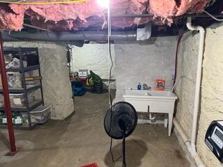 Before: Our Design Specialist, Brady, recommended securing several waterproofing products in the basement.