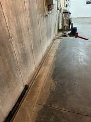 Before: Our Design Specialist suggested securing WaterGuard along the damaged walls.