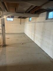 Before: One of our Design Specialists, Dylan, recommended securing several waterproofing products throughout the basement.
