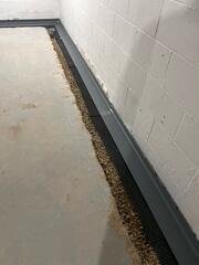 After: Our Foreman, Kiko, and his crew secured WaterGuard along the basement perimeter.