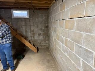 Before: Chuck, one of our Design Specialists, recommended securing GeoLock Wall Anchors on the cracked, damaged walls.