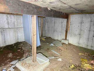 The uneven, sagging floors along with ongoing moisture issues originating from the crawl space below. The space had exposed earth and elevated humidity levels, which contributed to both structural instability and a damp environment beneath the home.