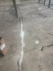 Epoxy grout at large cracks and spalled area.