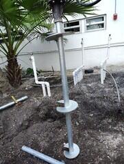 Installing helical piles around Coy Pond utilities