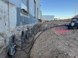 Locking off the retrofit helical piles near the service load