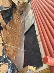 During: Our Foreman, Jesus, and his crew secured all the GeoLock Wall Anchors on the damaged wall.