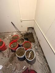 The pit is being dug out for the future home of the sump pump.