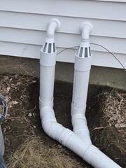 An IceGuard discharge line system to prevent backups during freezing temperatures