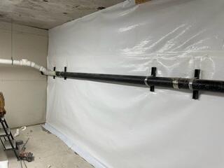 During: Our crew worked hard to secure all the products in the basement.