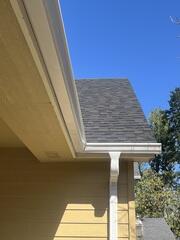 Installed 6-inch K-style gutters on the first story for improved water capacity by Installer, Edgar.
