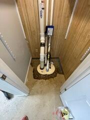 The components of the sump system were installed and gravel is backfilled around the pump