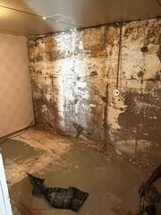 Before: Our Design Specialist, James, suggested waterproofing the entire basement.