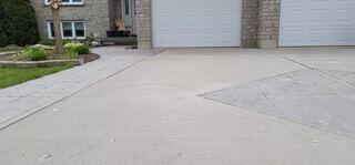 A wide view showing the entire driveway. It demonstrates the scale of the job and how we saved all that concrete without the need for a messy replacement.