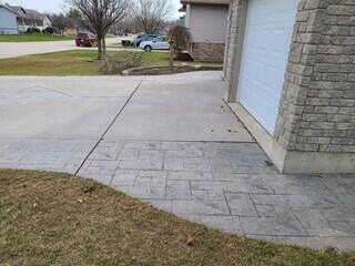 This shot shows the uneven ridge between the stamped and smooth concrete. It highlights the dangerous settlement that made the front walkway a hazard for the kids.