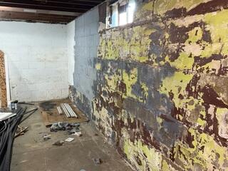 Before: Our Design Specialist suggested securing the waterproofing of the entire basement.