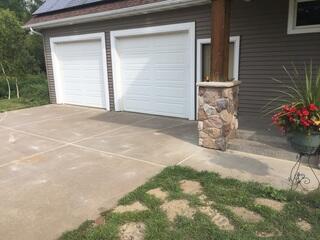 The driveway after our crew used PolyLevel to lift the uneven slabs and seal the joints and cracks with NexusPro