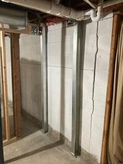 With our PowerBrace beams in place, we GUARANTEE the wall will not move any further inwards. What a relief.