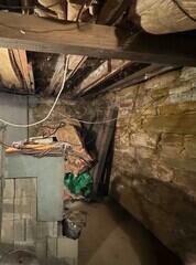 Because sandstone is a highly-porous material, groundwater was continuously seeping into the basement.