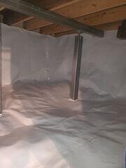 Encapsulating the crawl space seals out moisture, dirt, and pests! The crew also installed SmartJacks in the crawl space to stabilize and lift the floors above back toward their original position.