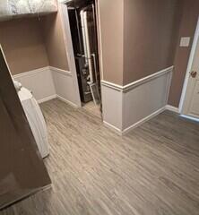 Our EverLast Wall Restoration was installed on the bottom half of the basement wall in this photo, giving it a finished look while working seamlessly with the flooring.