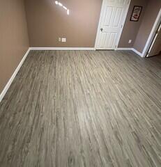 Our Elite Plank Flooring gives the floor a completely finished look while being water and mold resistant.