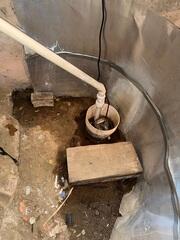 This old, failing sump pump needs to be replaced.