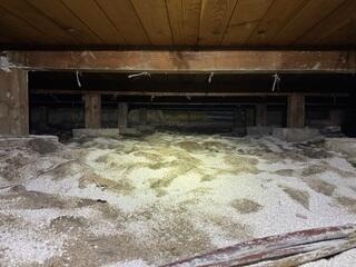 Unprotected crawl space with no vapor barrier or insulation or sealed vents.