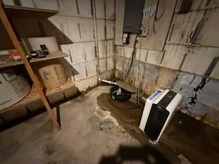 Before: Our Design Specialist, Ryan, recommended waterproofing the entire space.