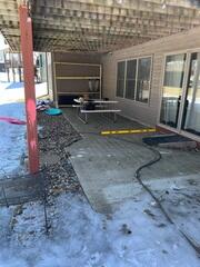 The back porch before our crew lifted and leveled the area