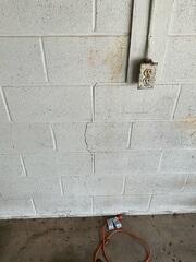Stairstep cracks in brick or block walls are a common sign of foundation settlement or structural movement. These cracks often follow the mortar joints in a stair-step pattern as the foundation shifts unevenly over time. If left unaddressed, stairstep cracks can worsen and lead to additional structural damage, making early foundation repair important for long-term stability.