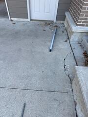 Before: Our Design Specialist, Tony, recommended securing several concrete lifting products throughout the driveway.