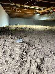 The crawl space before our crew installed our waterproofing solutions