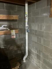 The basement where the piping is installed to the concrete floor and connected to the extraction point