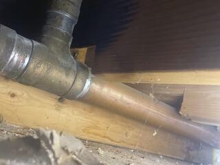The bathroom pipes are freezing, and as the water expands, it increases the risk of the pipes bursting.