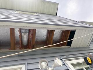 We removed the soffit panel and installed SilverGlo rigid foam boards with a radiant barrier to block cold air from entering, helping prevent frozen pipes and reduce drafts. Next, we sealed all gaps with ZypFoam to stop air leakage. Finally, we reinstalled the soffit panels.