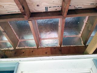 We removed the soffit panel and installed SilverGlo rigid foam boards with a radiant barrier to block cold air from entering, helping prevent frozen pipes and reduce drafts. Next, we sealed all gaps with ZypFoam to stop air leakage. Finally, we reinstalled the soffit panels.
