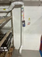 The interior of the home where the piping is installed through the concrete floor in the basement