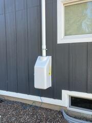 The exterior of the home where our radon mitigation fan is installed