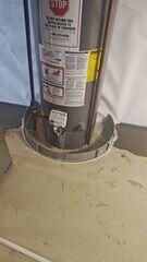 We install a floor dam around appliances like this water heater to protect them against flooding.