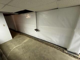 Our CleanSpace basement wall vapor barrier seals out leaks and eliminates unsightly paint issues.