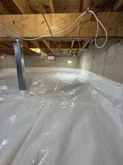 Installed a durable vapor barrier across the entire crawl space floor and along the walls
Installed SmartJack support posts to stabilize and reinforce the structure above