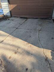 Before: James, one of our Design Specialists, recommended lifting the sinking driveway back to its original level.