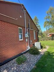 Before: The Design Specialist recommended securing a Radon Mitigation System outside the home.