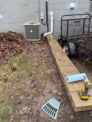 LawnScape outlet placed at discharge termination point, blending into the yard while ensuring safe water release.