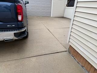 A close-up of the bumps that have formed along the driveway