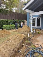 Before photo of our team digging down to the foundation of the home. 
8 to 10 feet for this specific home.