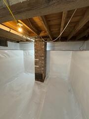 The crawl space now has the clean space wall and floor systems installed. Providing an excellent vapor barrier to the area.