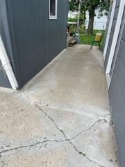 During: Our Foreman, Charlie, and his crew leveled the sidewalk back to its original position.