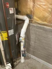 The piping is installed through the concrete floor connecting to the fan at the exterior of the home