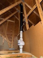 The attic of the garage where the fan is installed